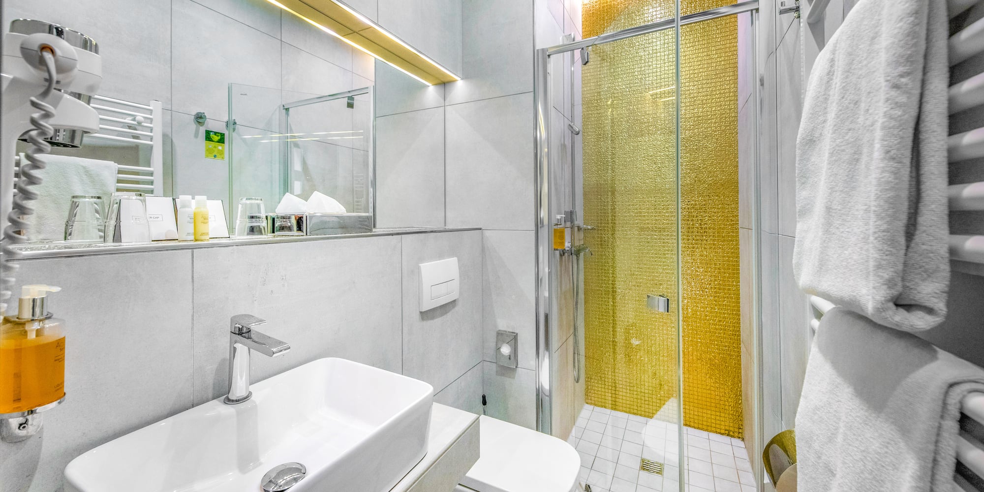 a bathroom with a shower and sink