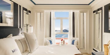 a room with a bed and a window