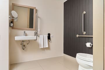 a bathroom with a sink and mirror