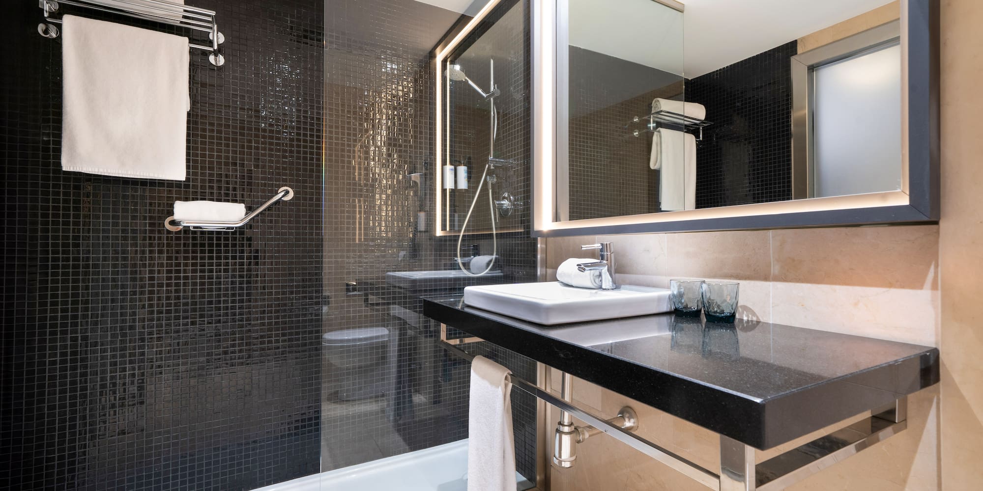 a bathroom with a shower and sink