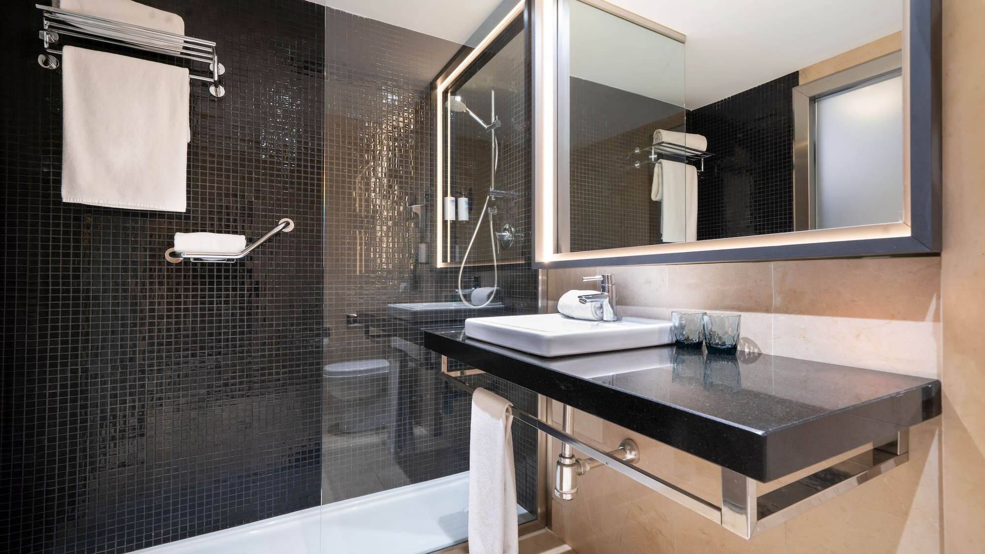 a bathroom with a shower and sink