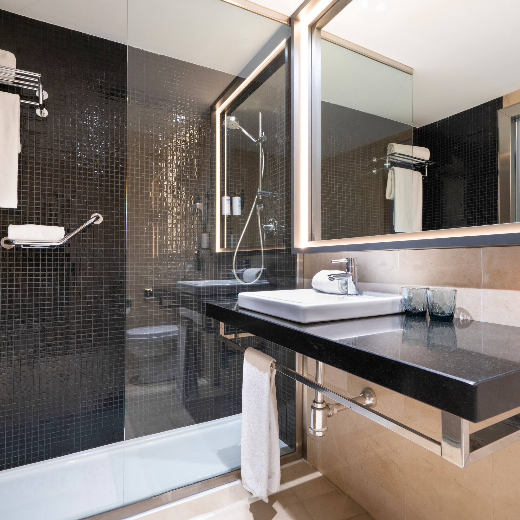 a bathroom with a shower and sink