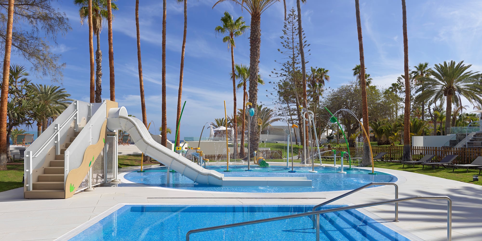 a pool with a slide and a slide in it