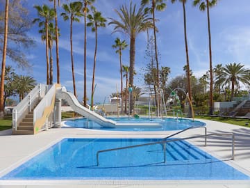 a pool with a slide and a slide in it
