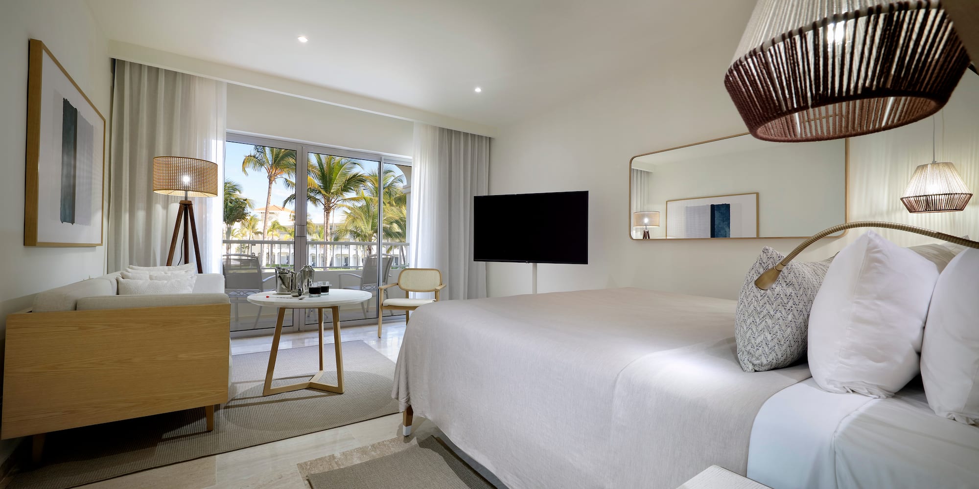 a bedroom with a bed and a television