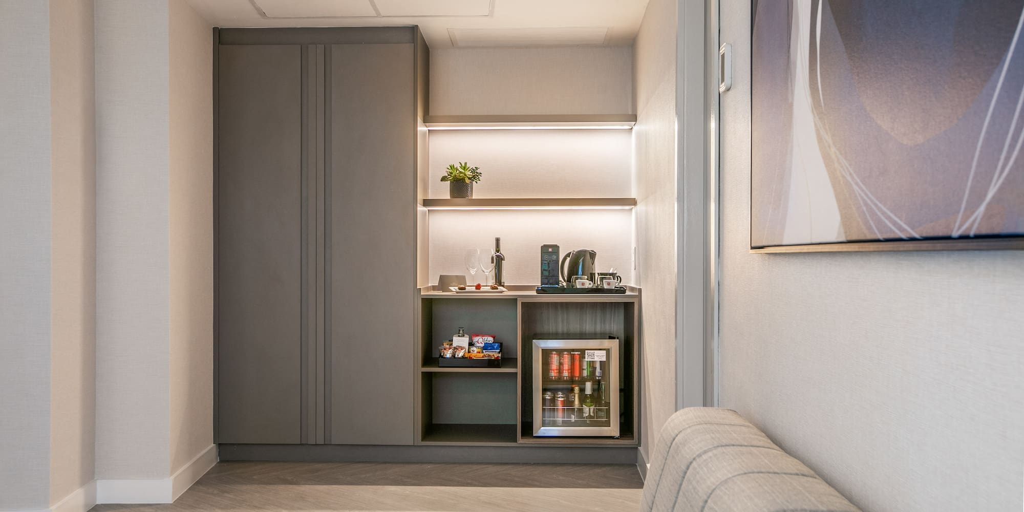 a room with a couch and a coffee machine