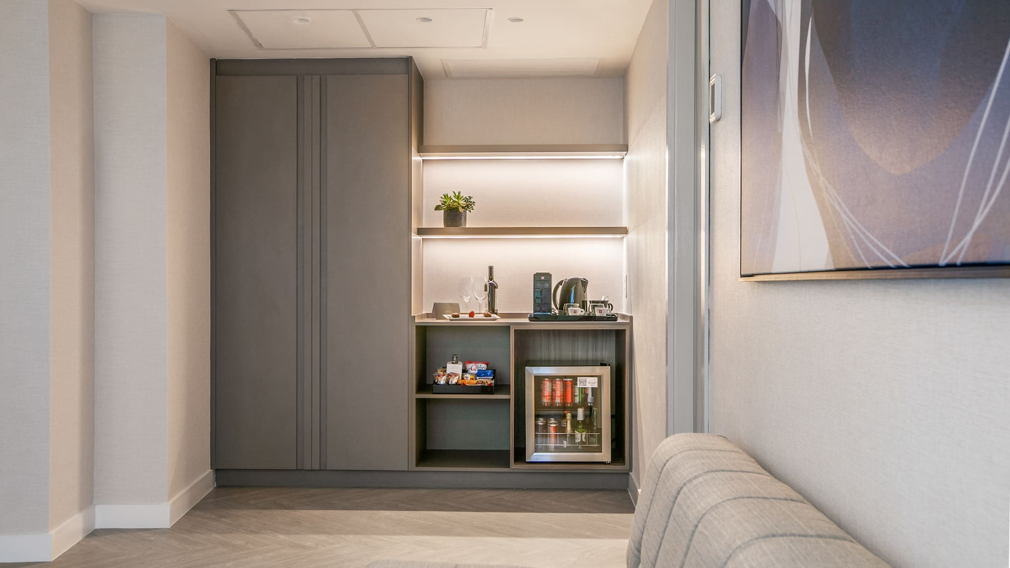 a room with a couch and a coffee machine