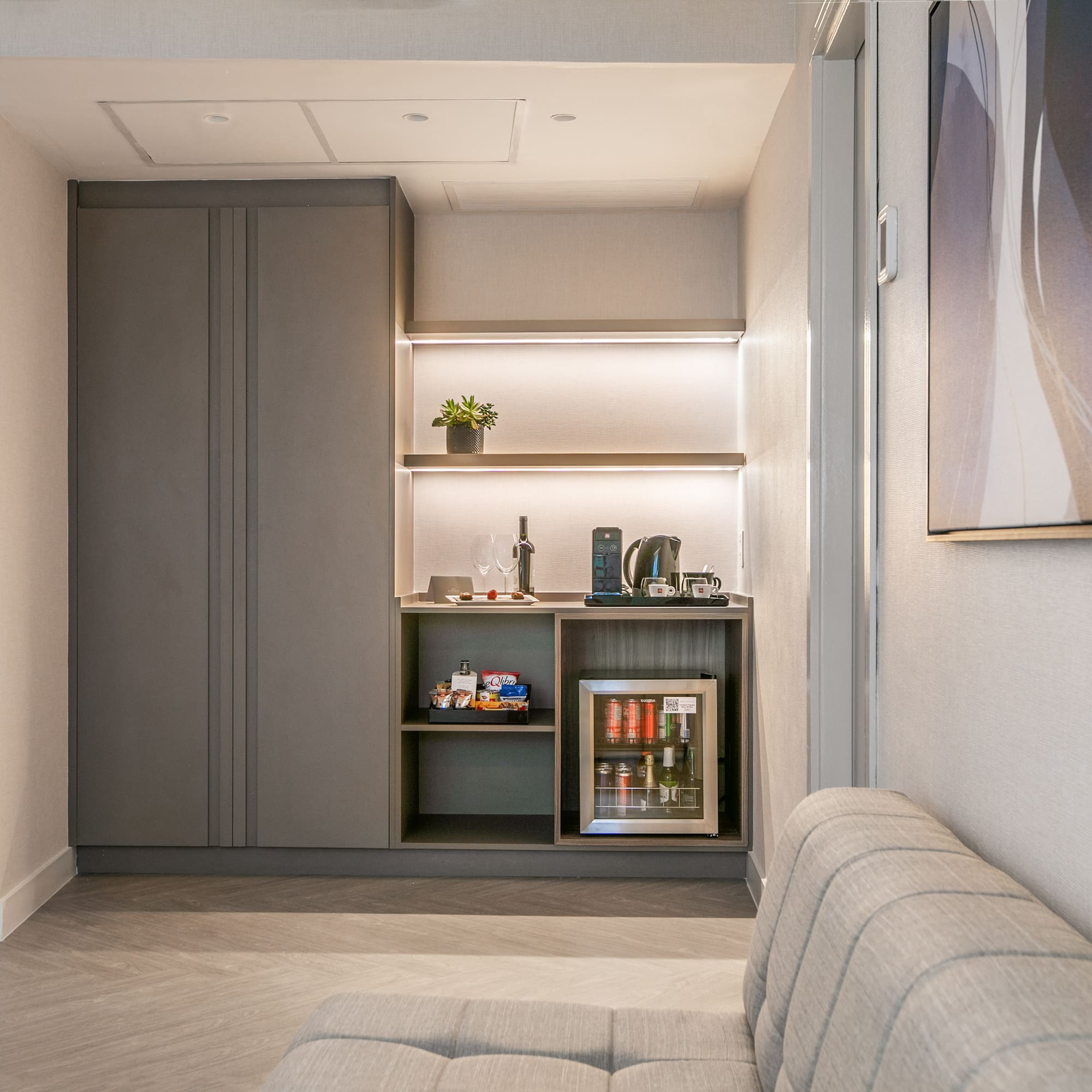 a room with a couch and a coffee machine