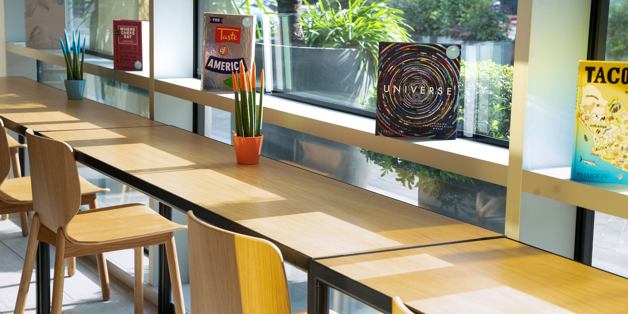 a table with chairs and a book on it