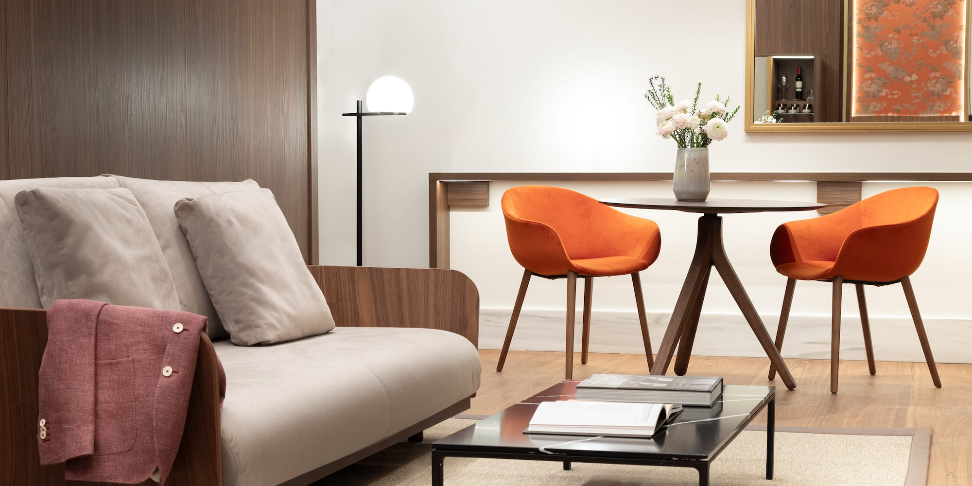 a living room with a table and chairs