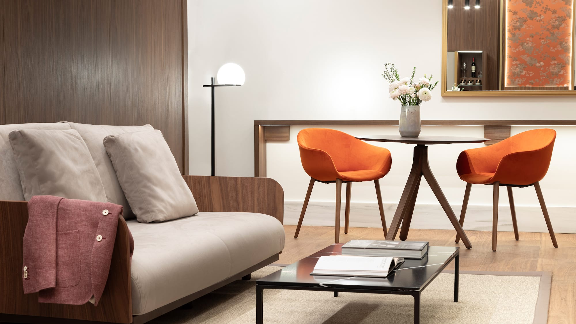 a living room with a table and chairs