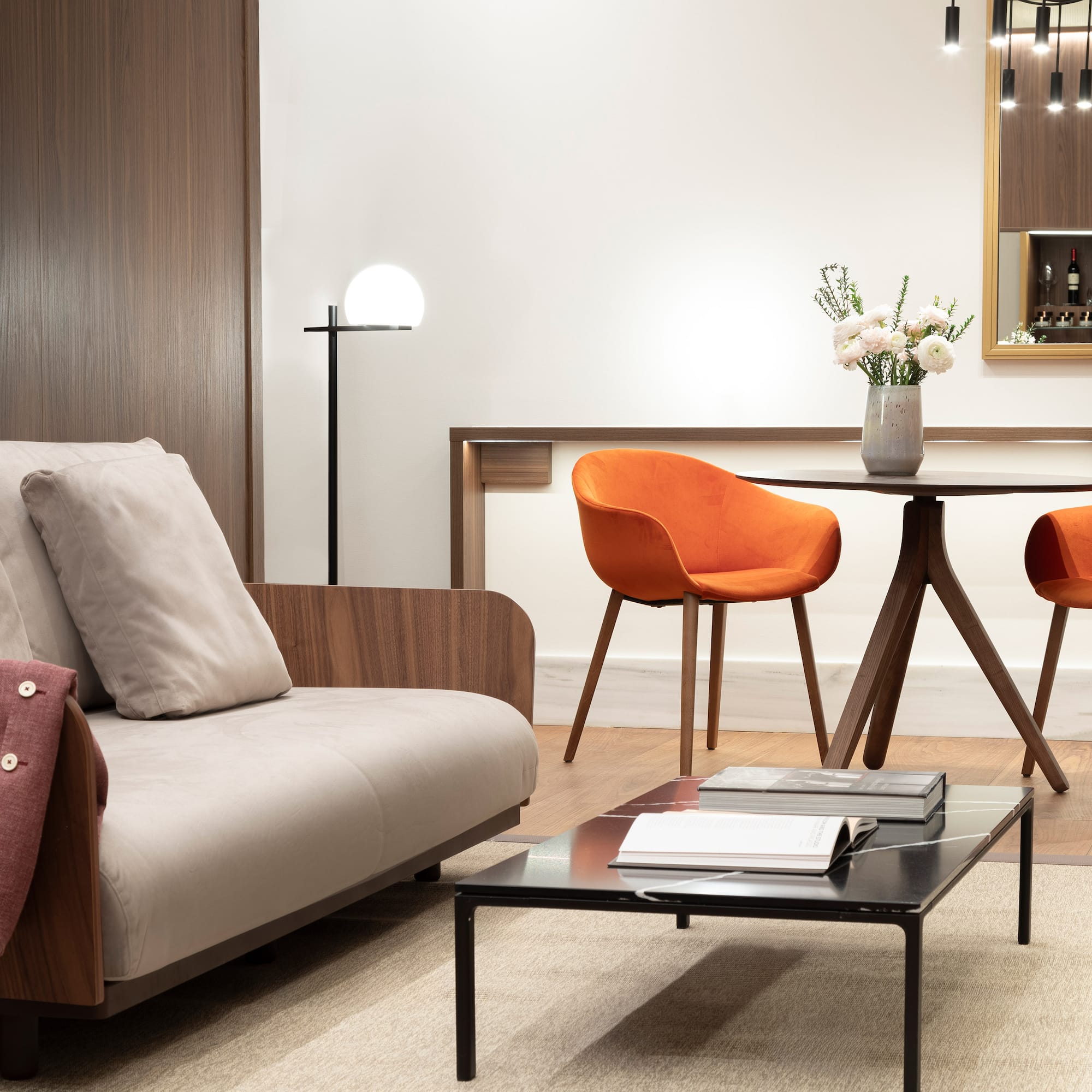 a living room with a table and chairs