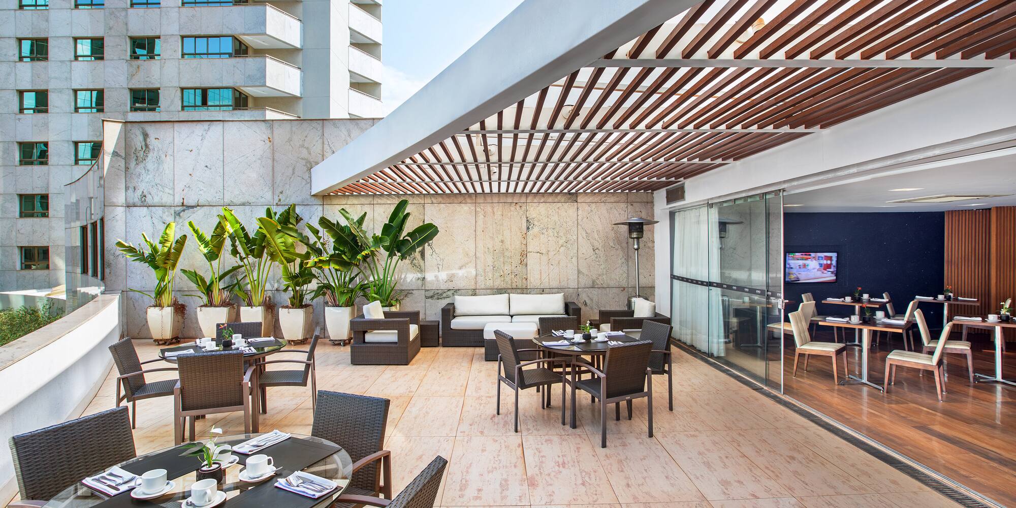 a patio with tables and chairs