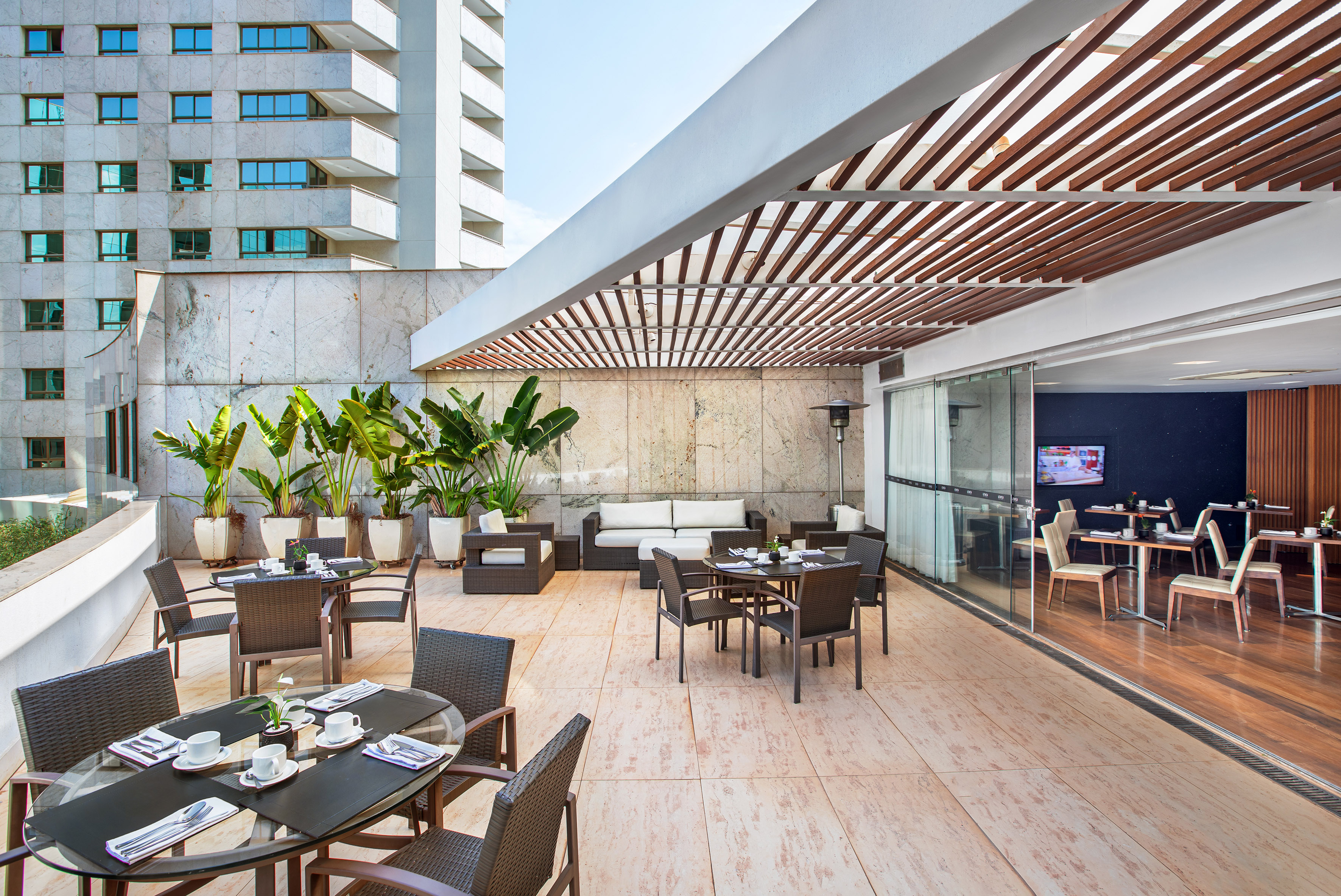 a patio with tables and chairs