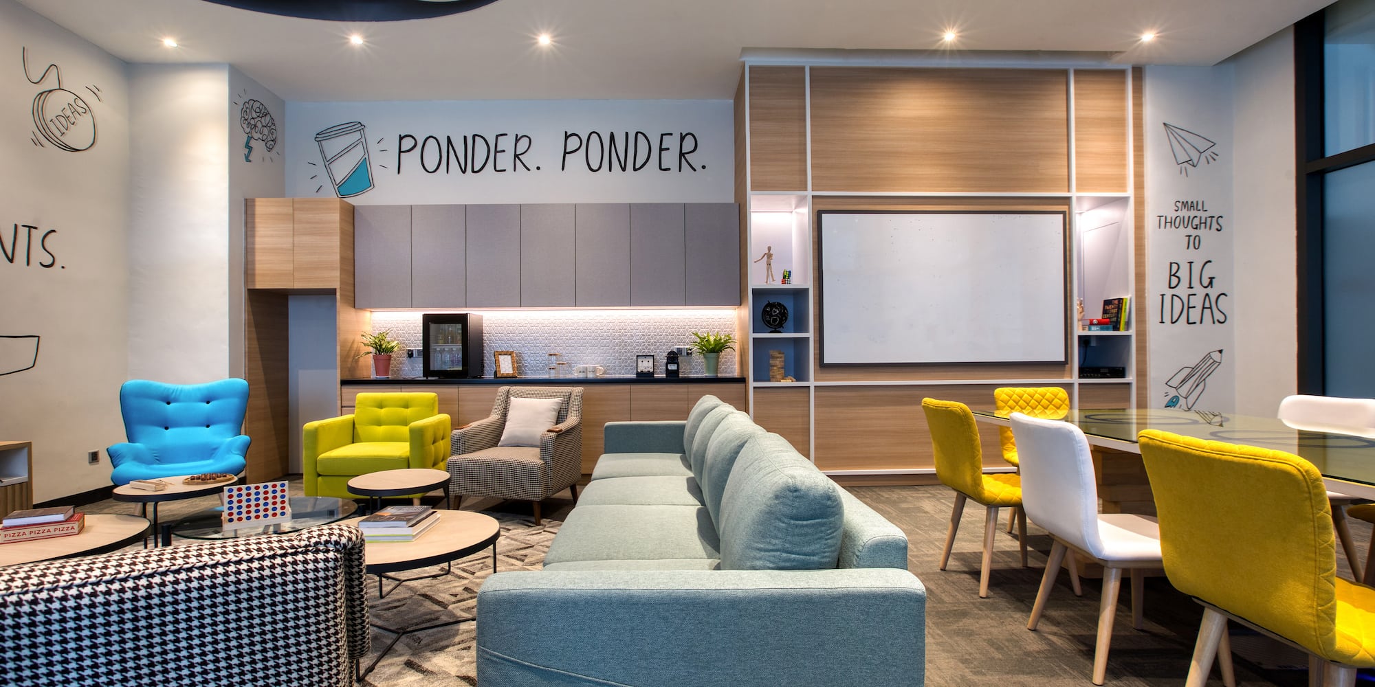 a room with couches and chairs