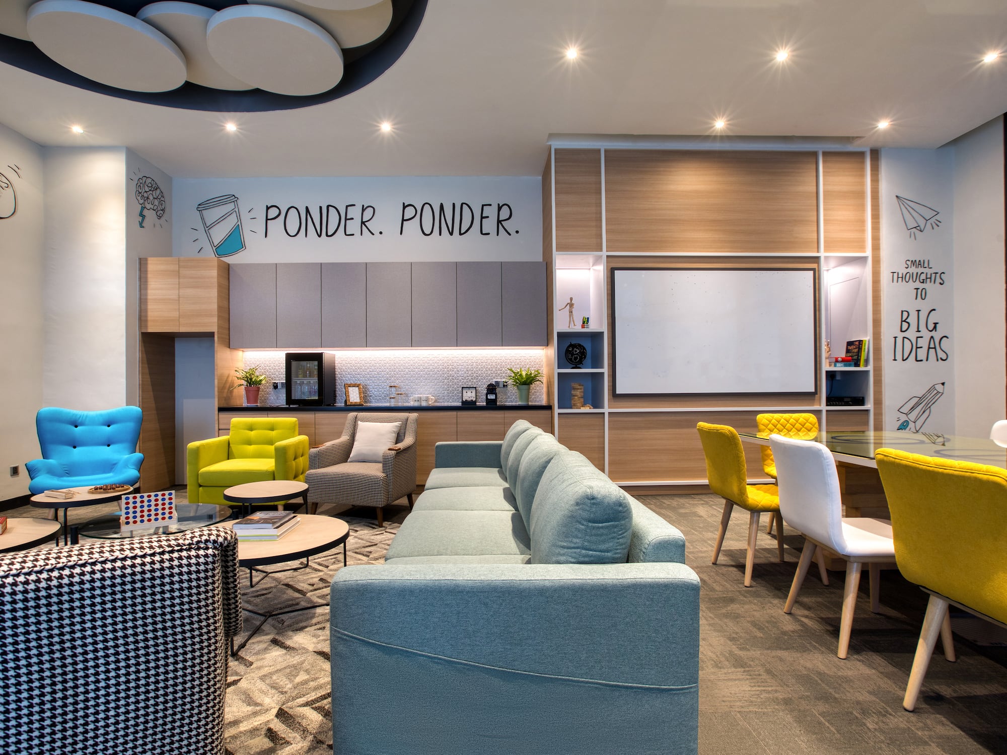 a room with couches and chairs