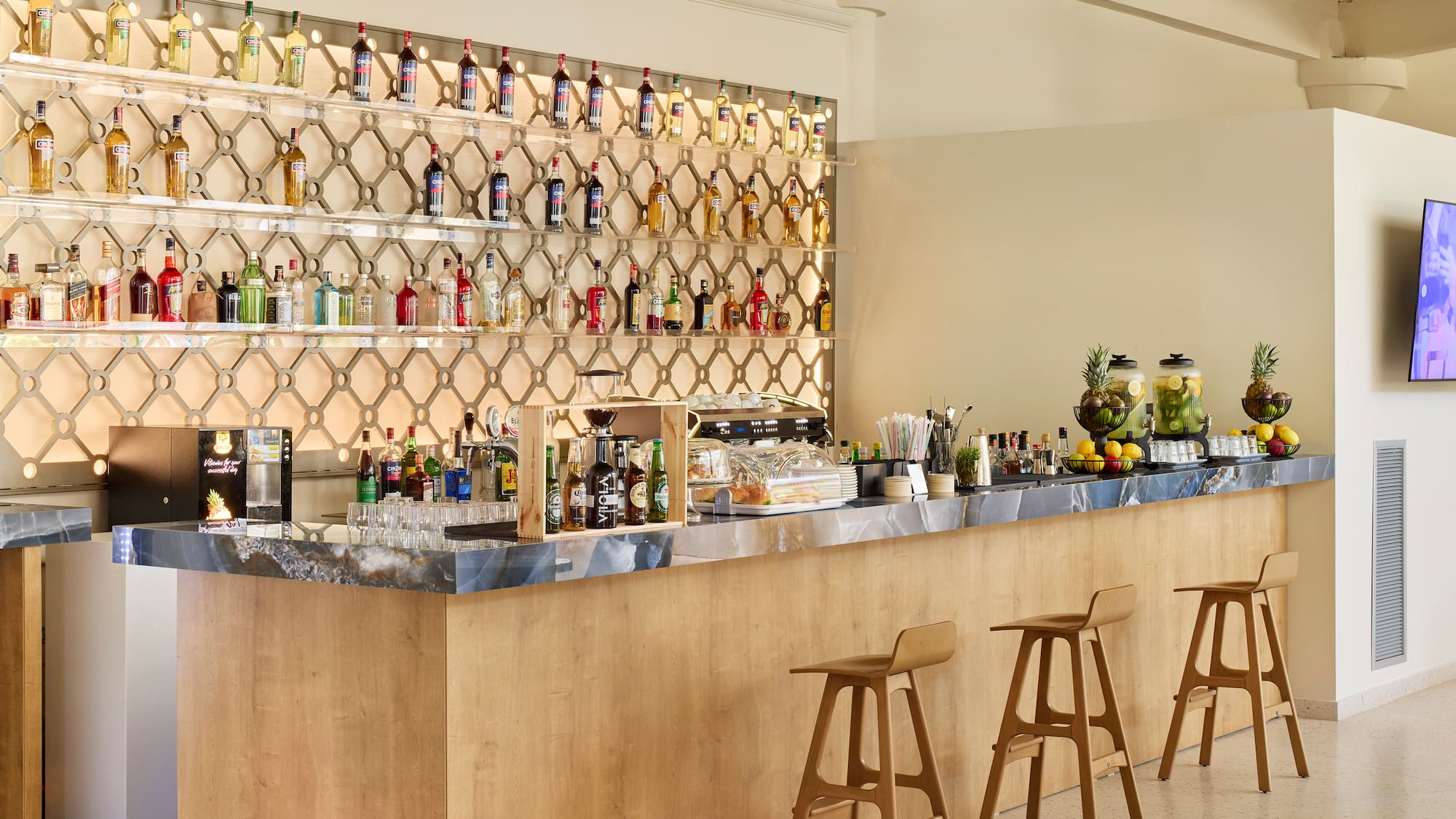 a bar with bottles of alcohol on the wall