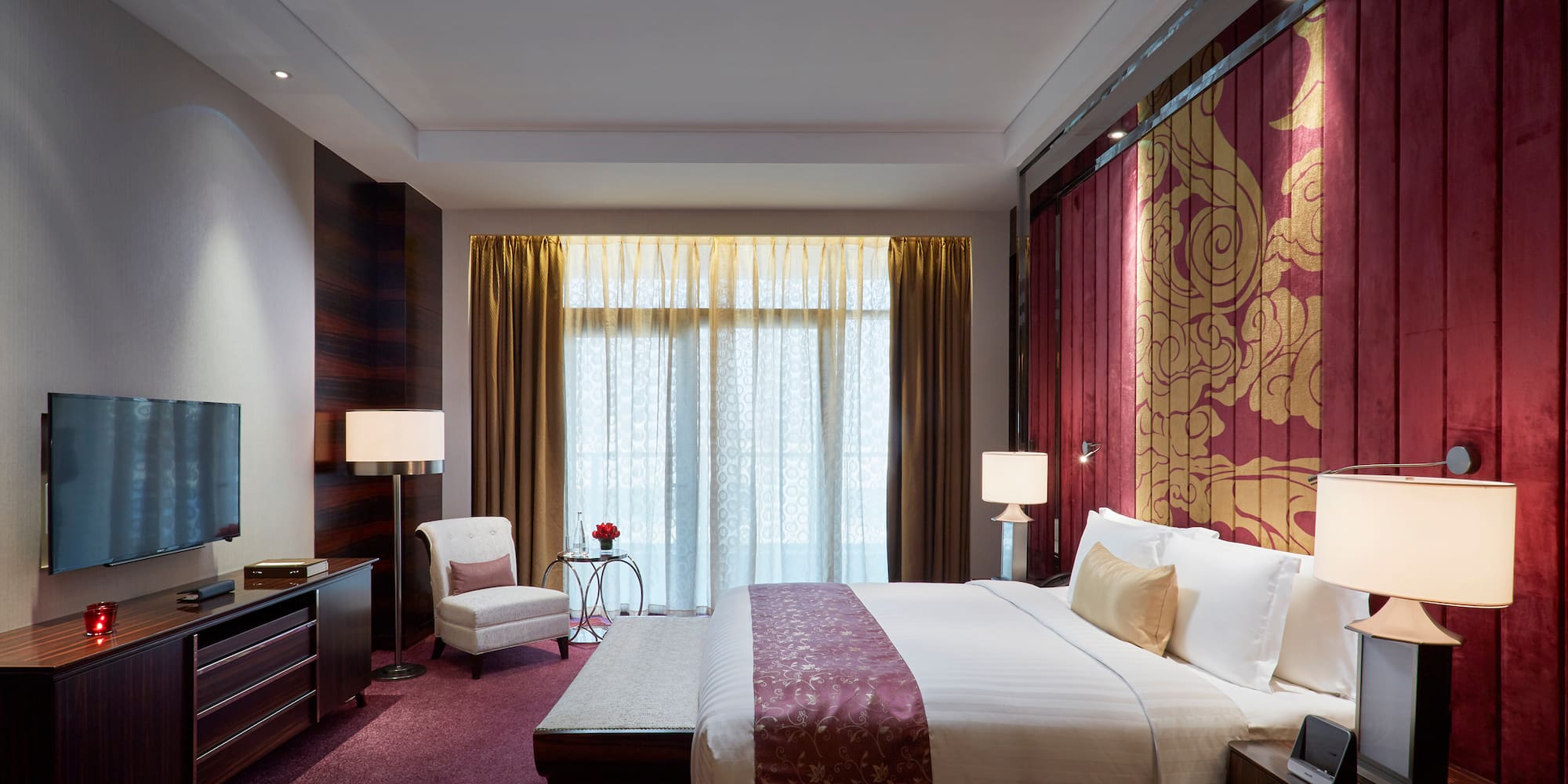 a bedroom with a bed and a chair