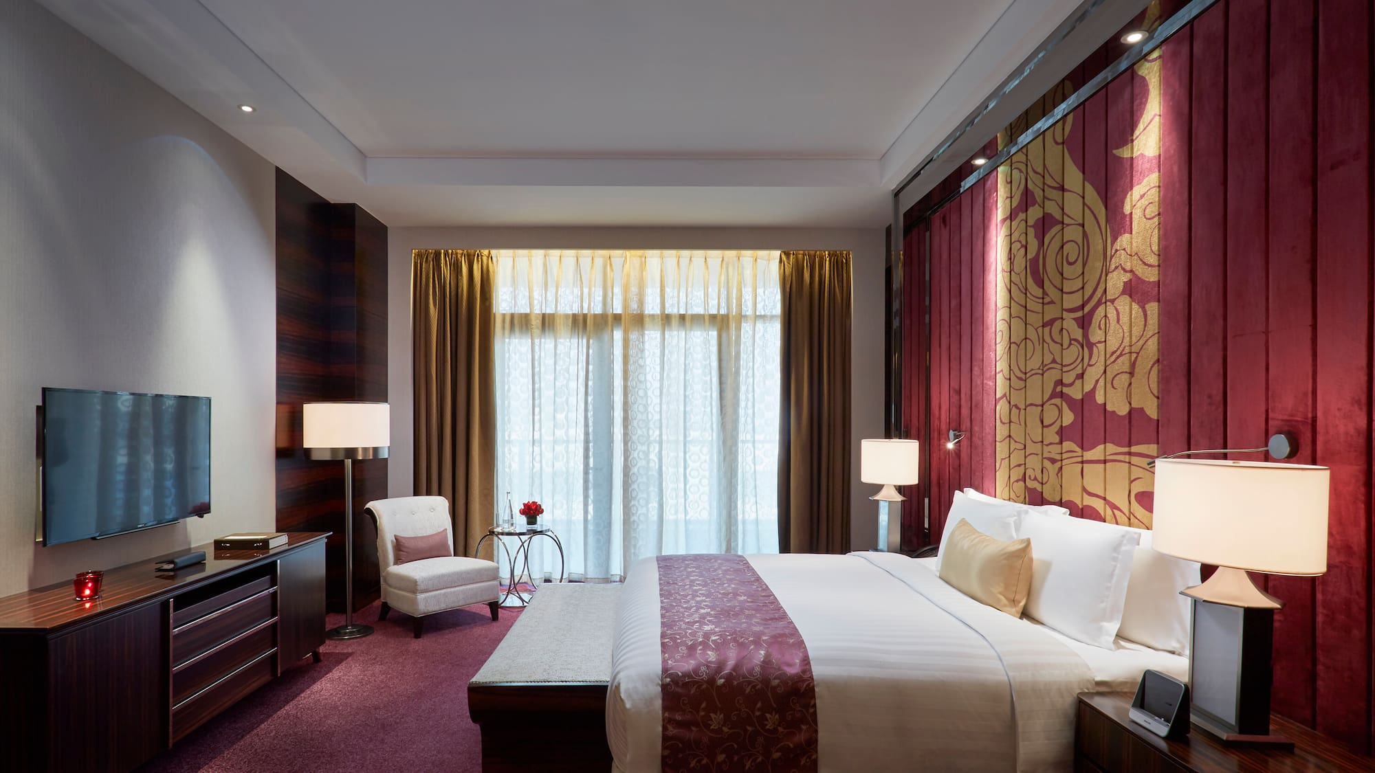 a bedroom with a bed and a chair