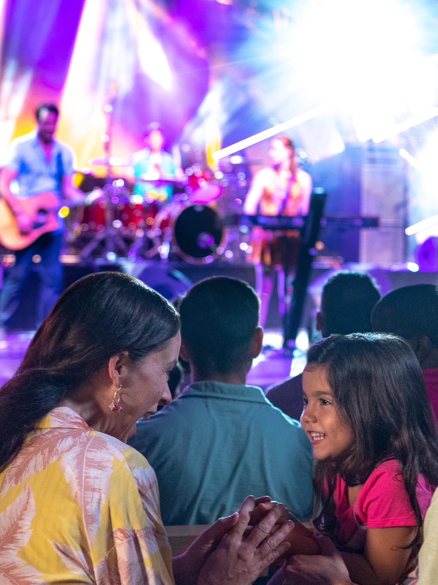 a group of people in front of a stage
