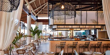 a restaurant with tables and chairs