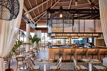 a restaurant with tables and chairs