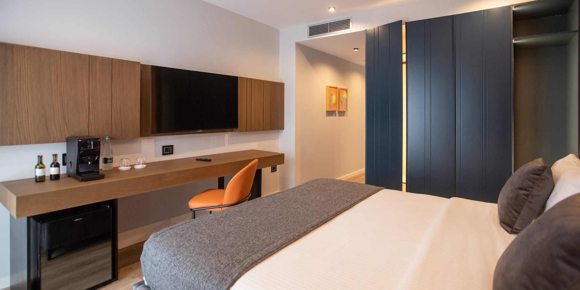 a room with a bed and a tv