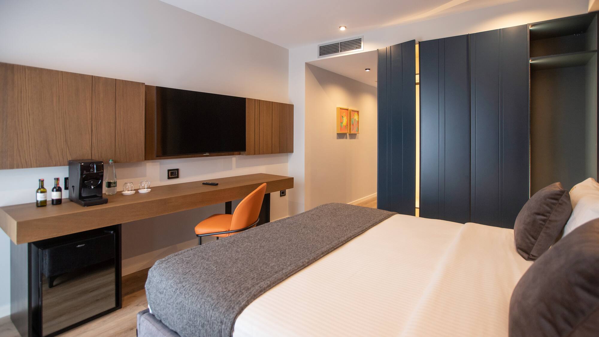 a room with a bed and a tv