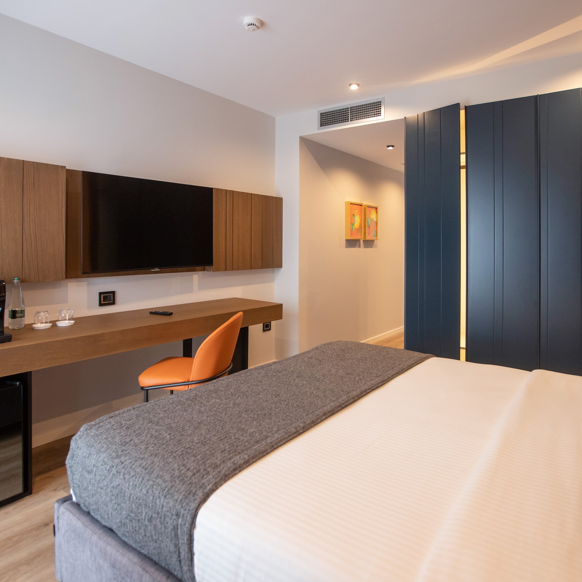 a room with a bed and a tv