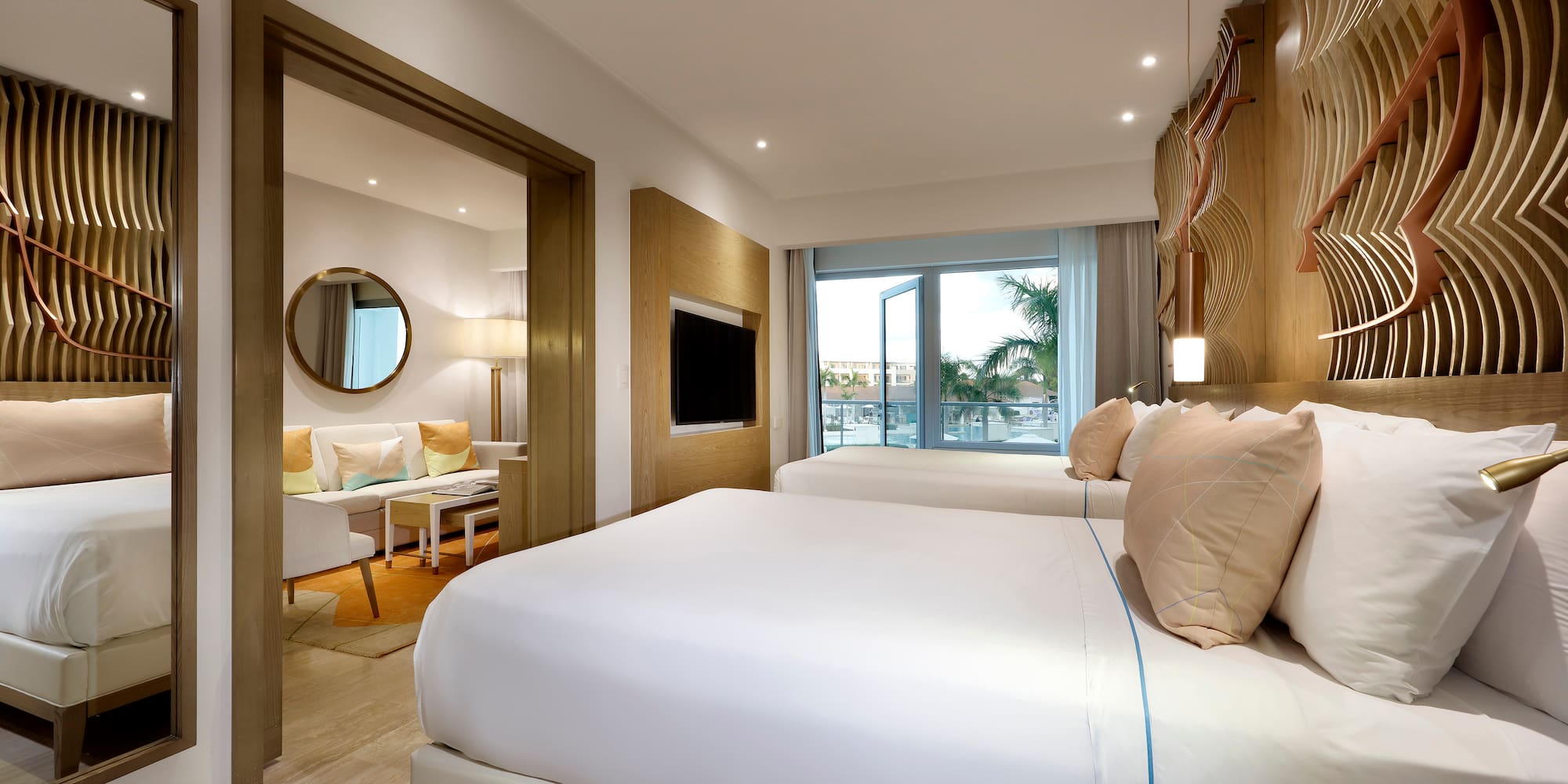 a bedroom with a bed and a television