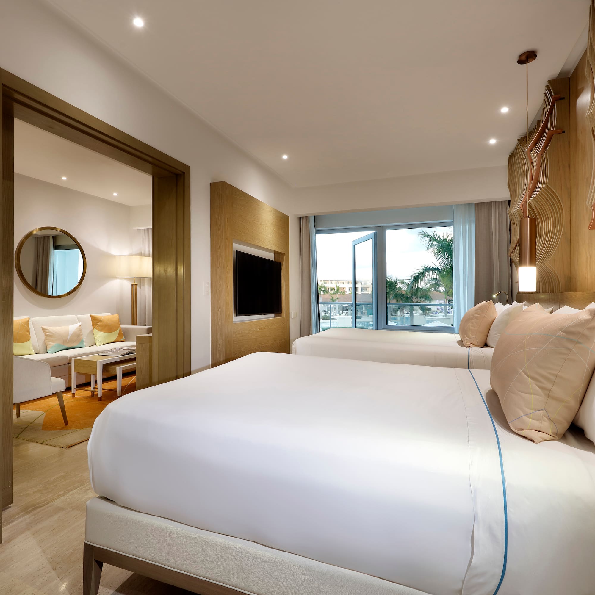 a bedroom with a bed and a television