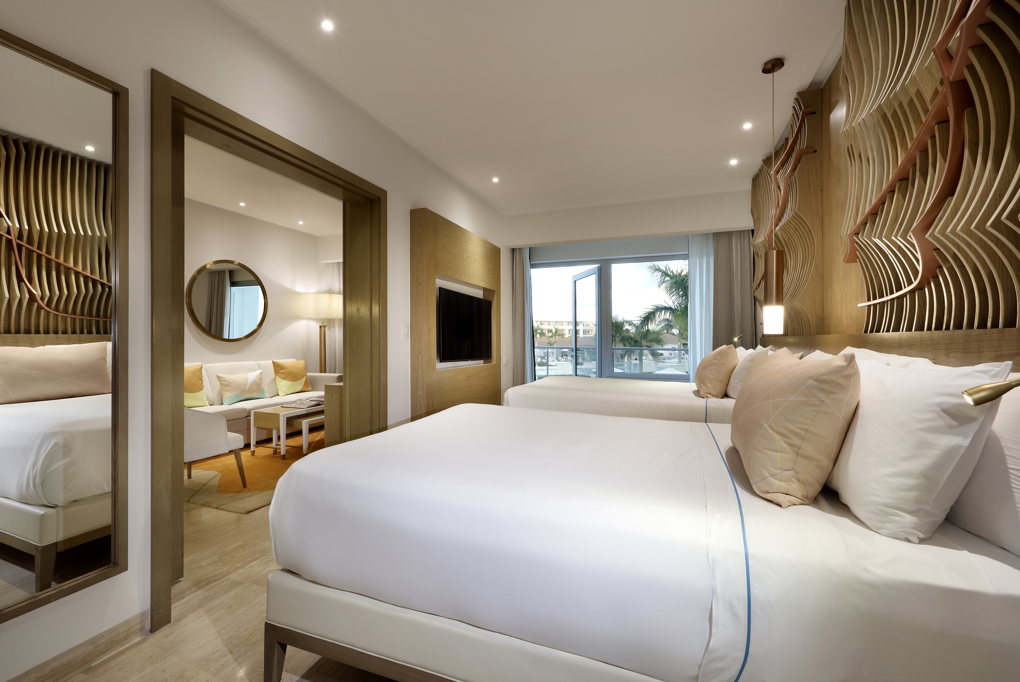 a bedroom with a bed and a television