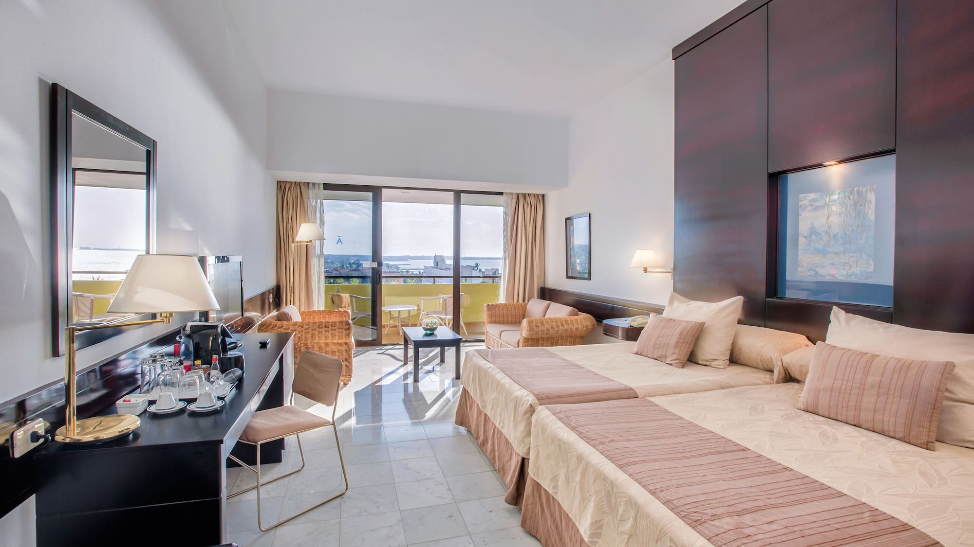 a room with two beds and a television