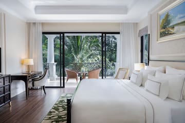 a bedroom with a large glass door