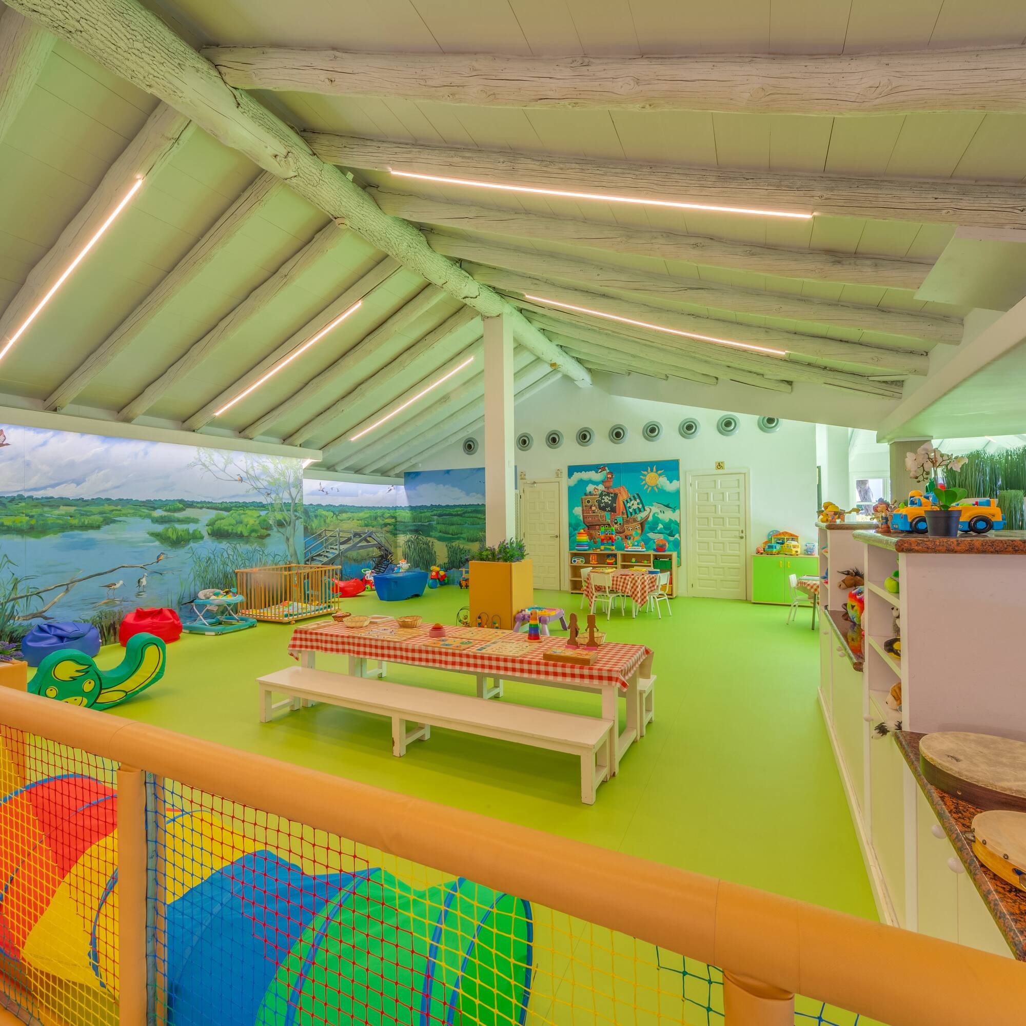 a room with a large table and chairs