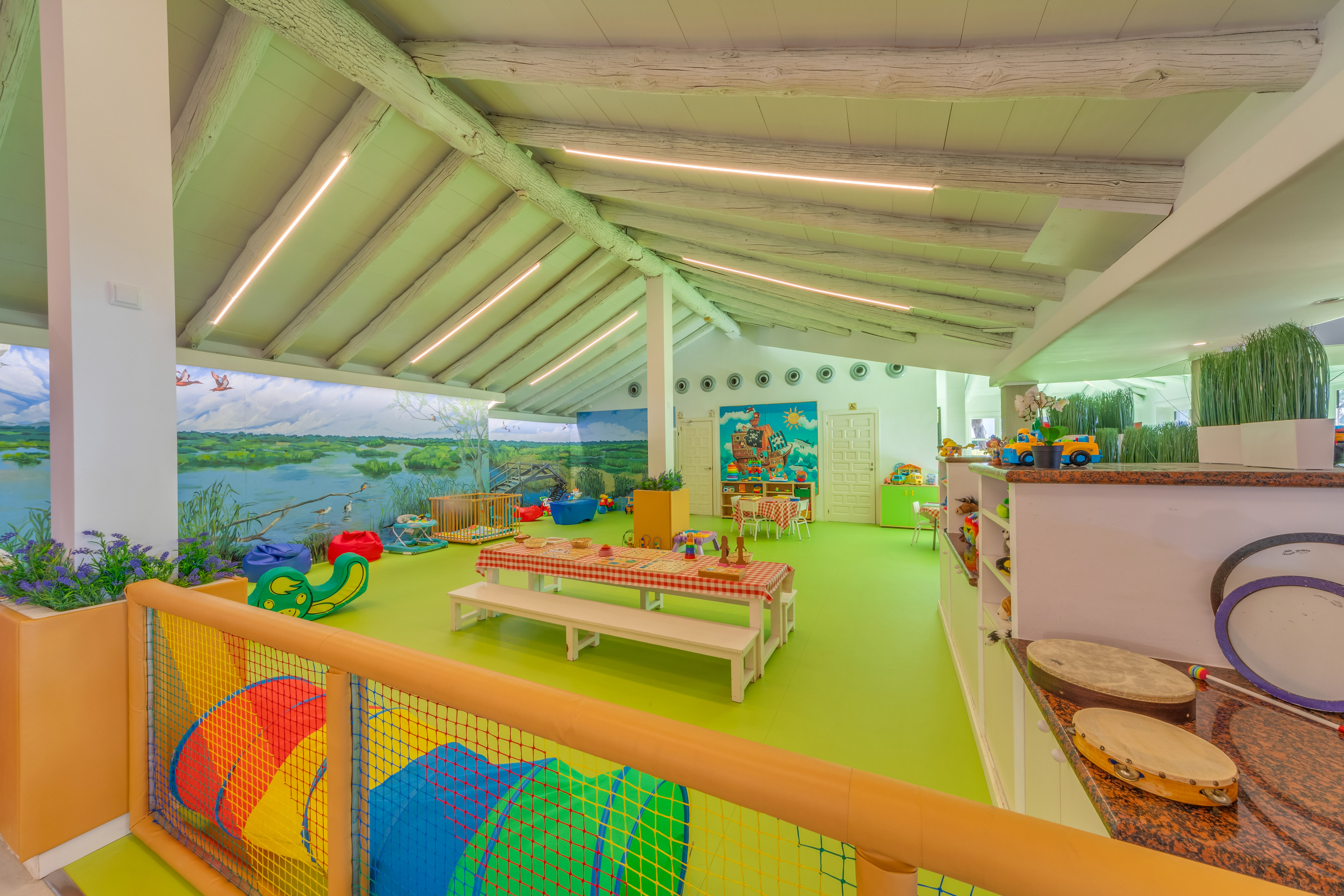 a room with a large table and chairs