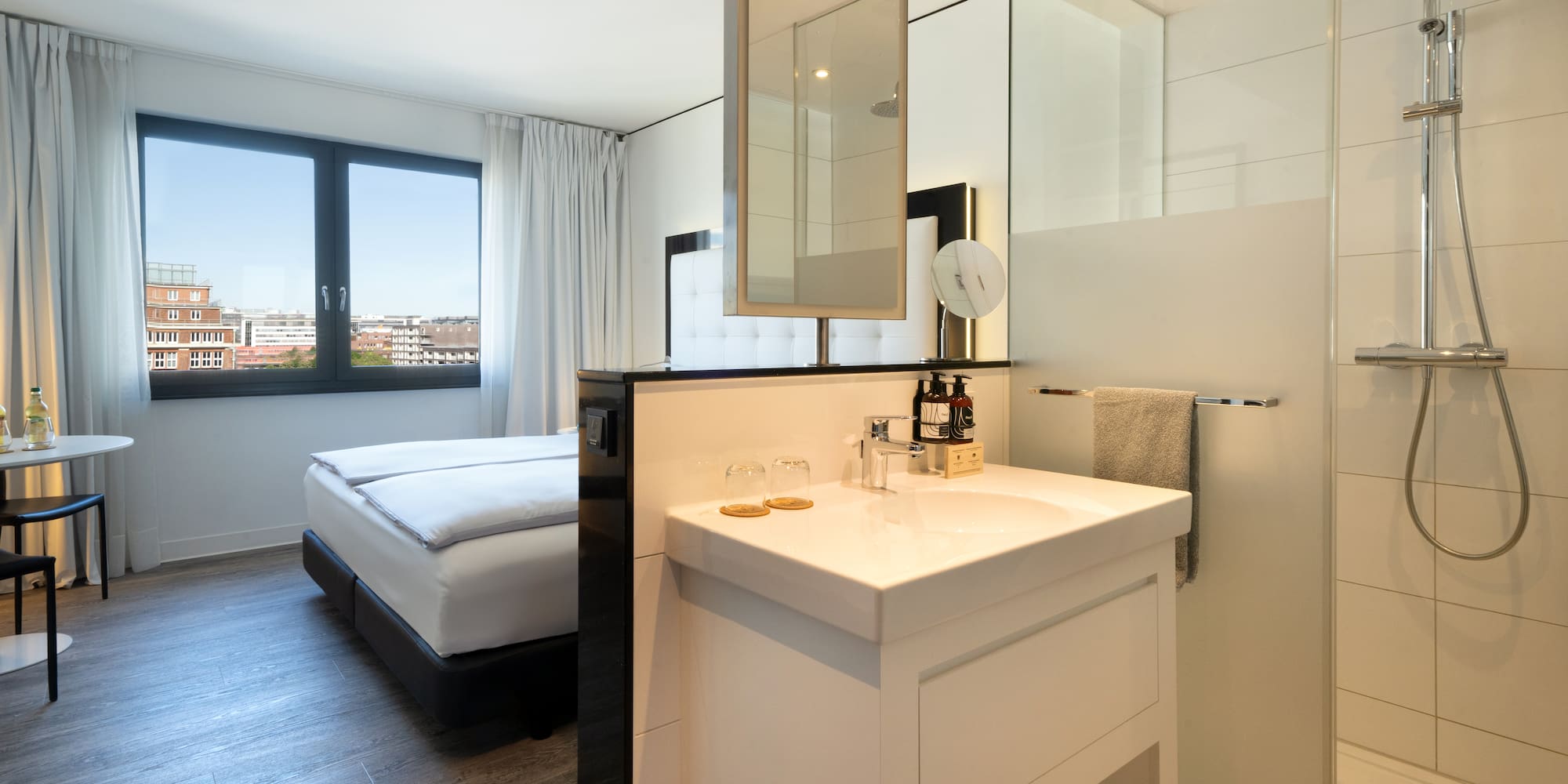 a bathroom with a bed and a sink