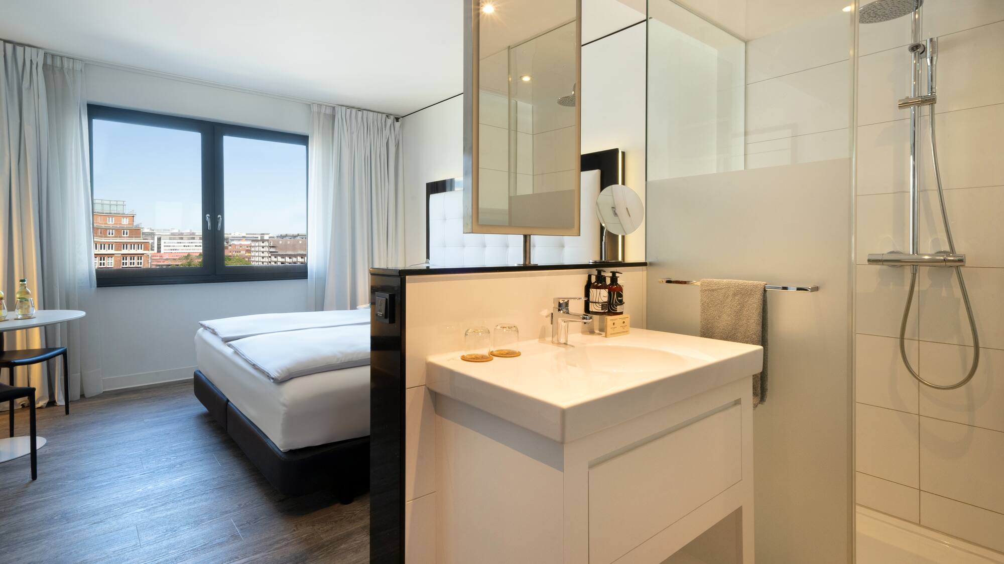 a bathroom with a bed and a sink