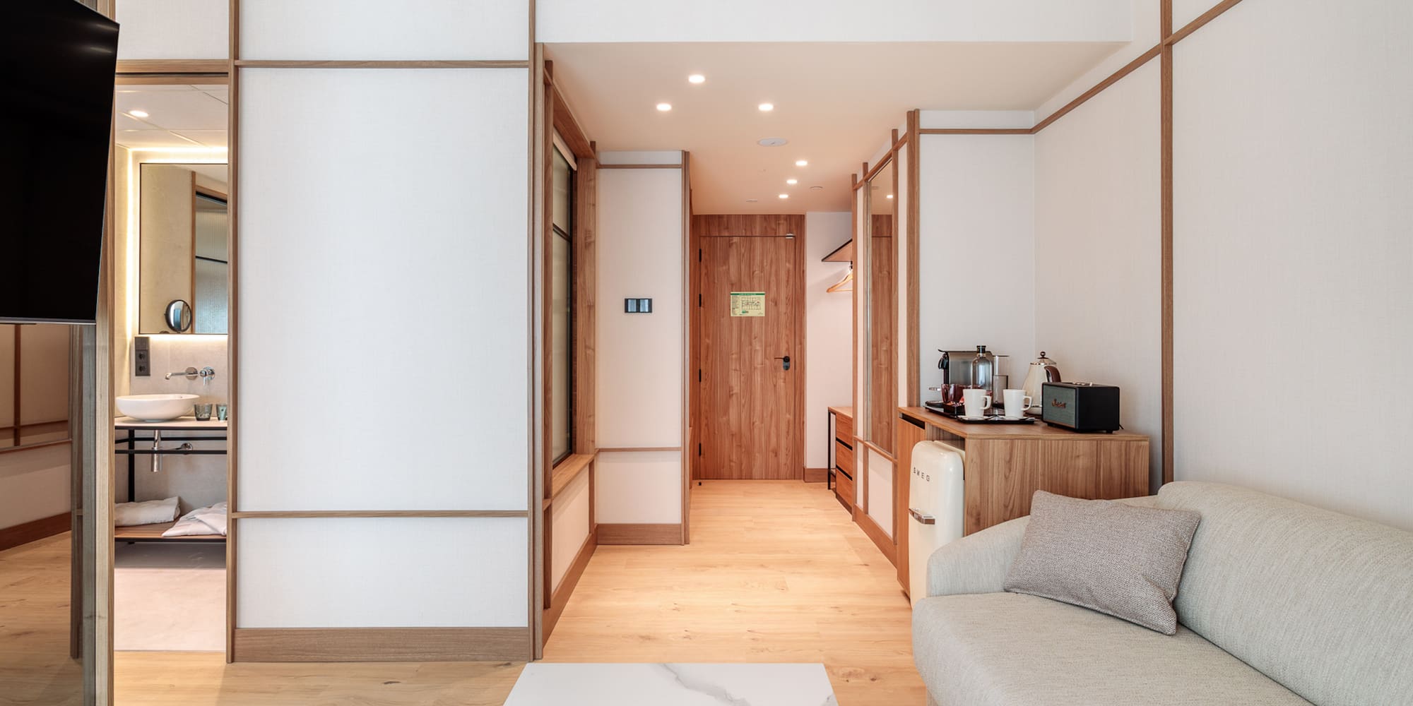 a room with a couch and a microwave