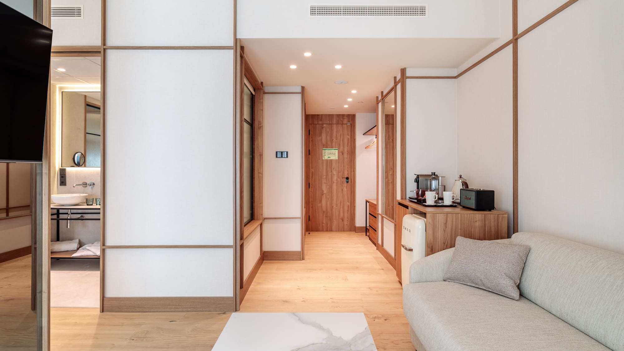 a room with a couch and a microwave