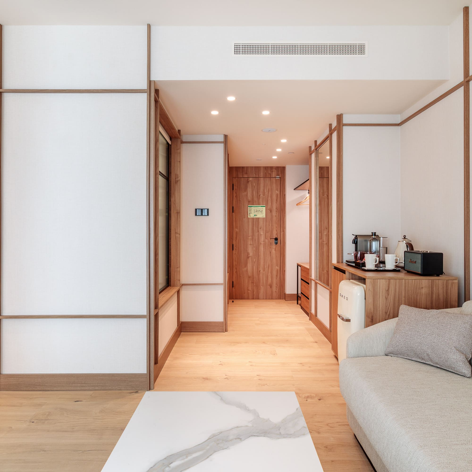 a room with a couch and a microwave