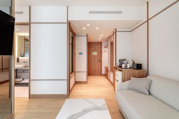 a room with a couch and a microwave