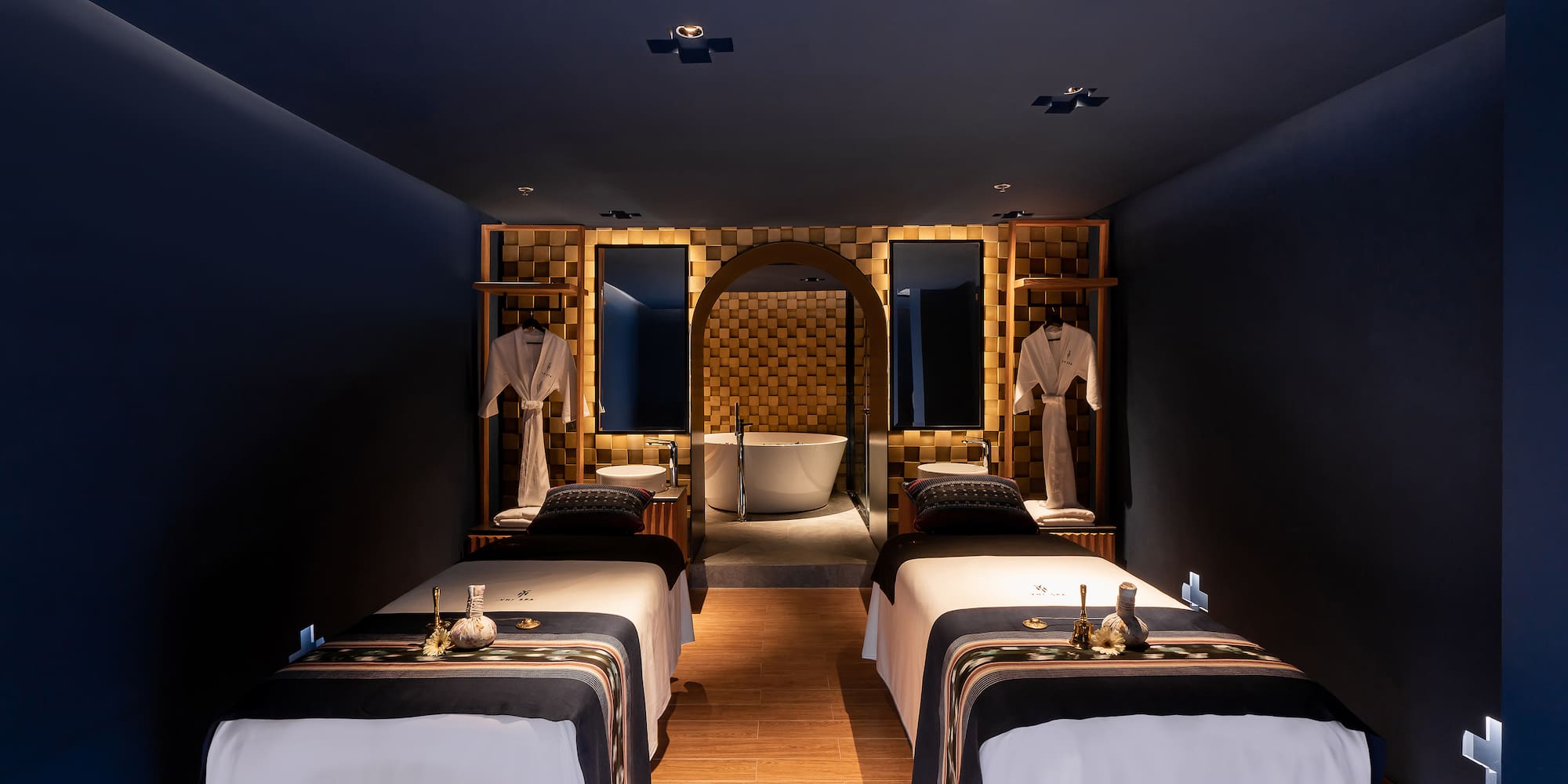 a room with beds and a bathtub