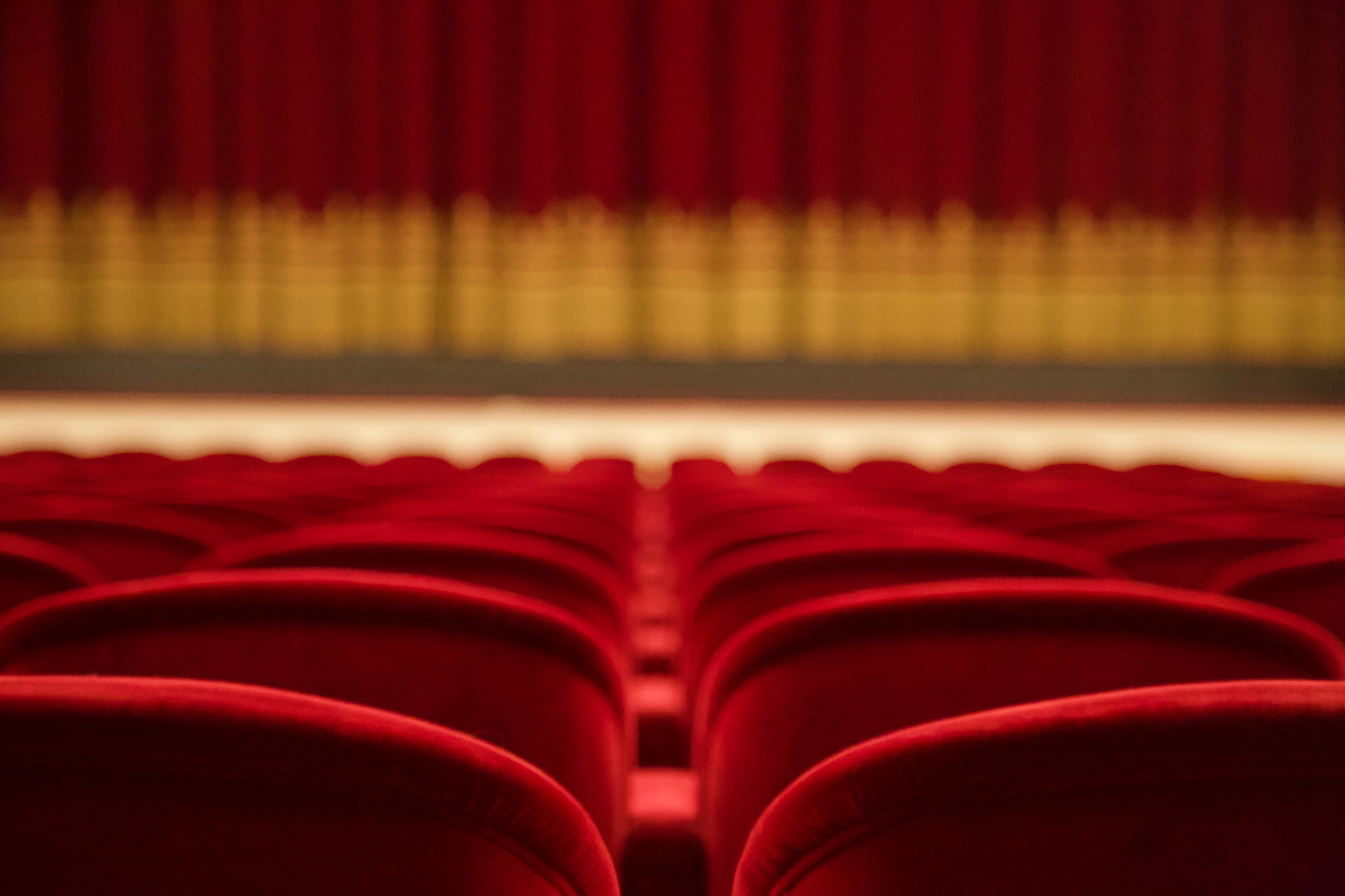 a red theater seats in a row