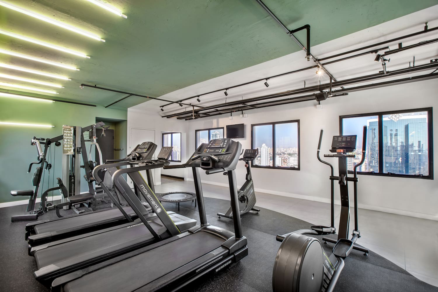 a room with treadmills and exercise equipment