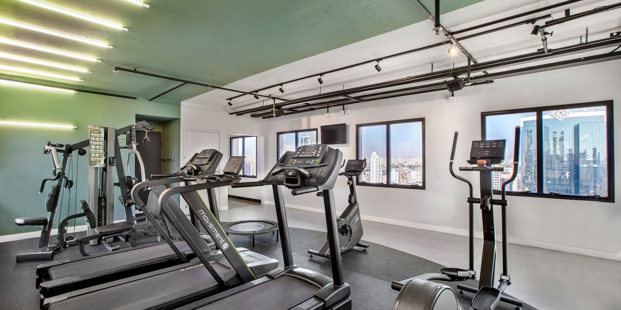 a room with treadmills and exercise equipment