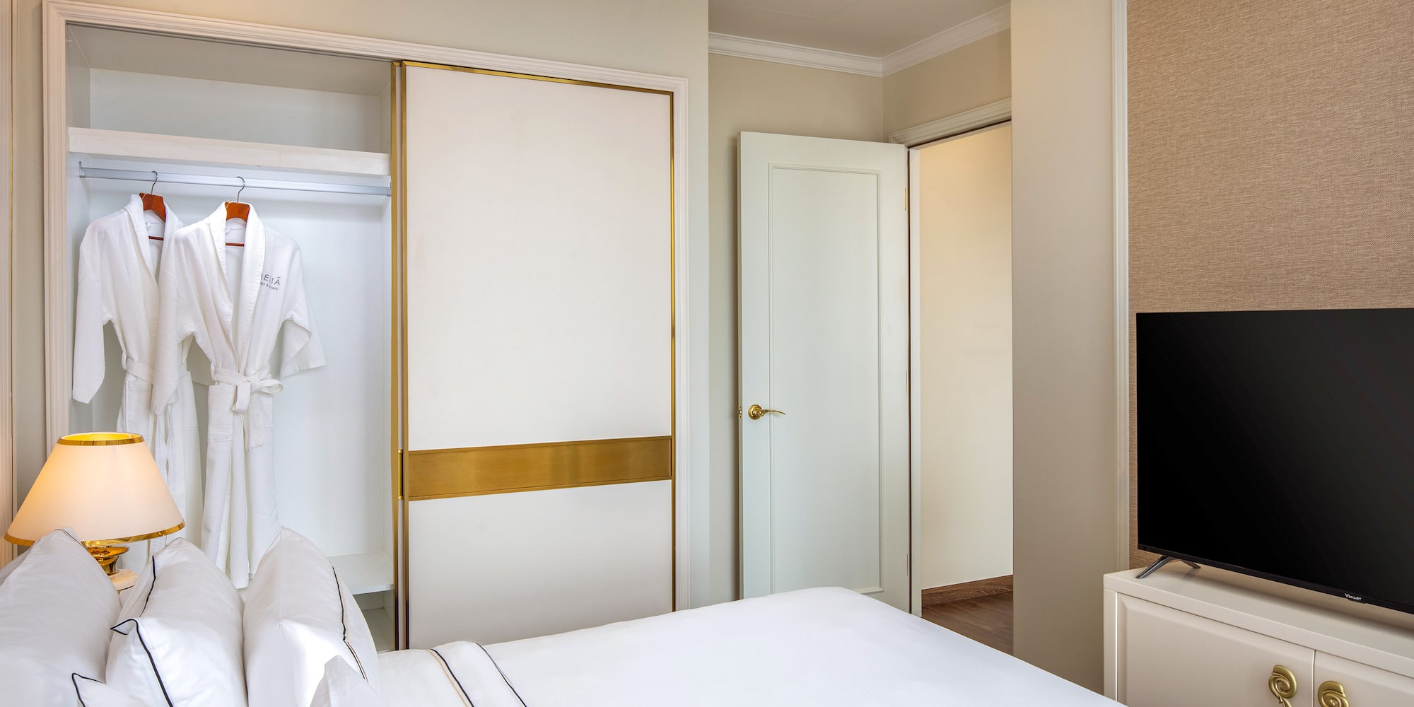 a room with a bed and a tv