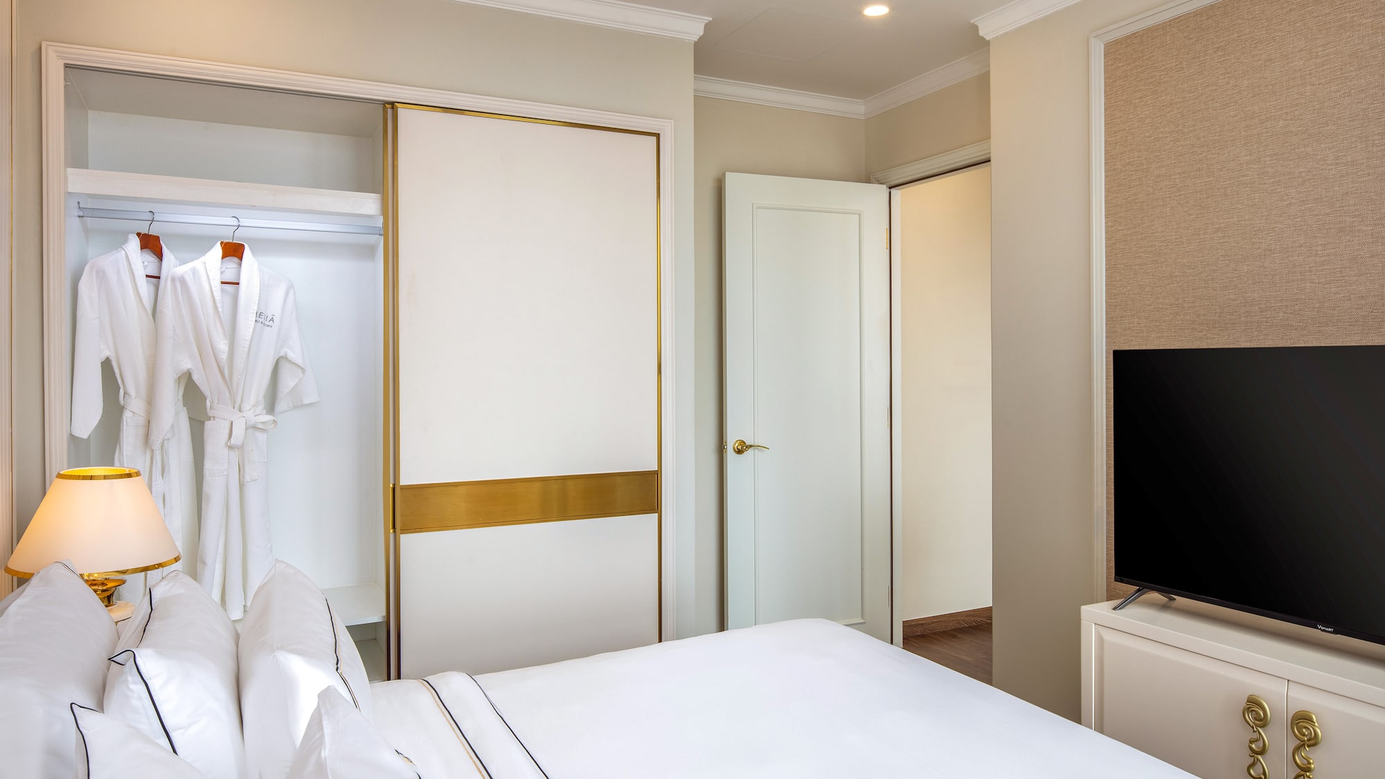 a room with a bed and a tv