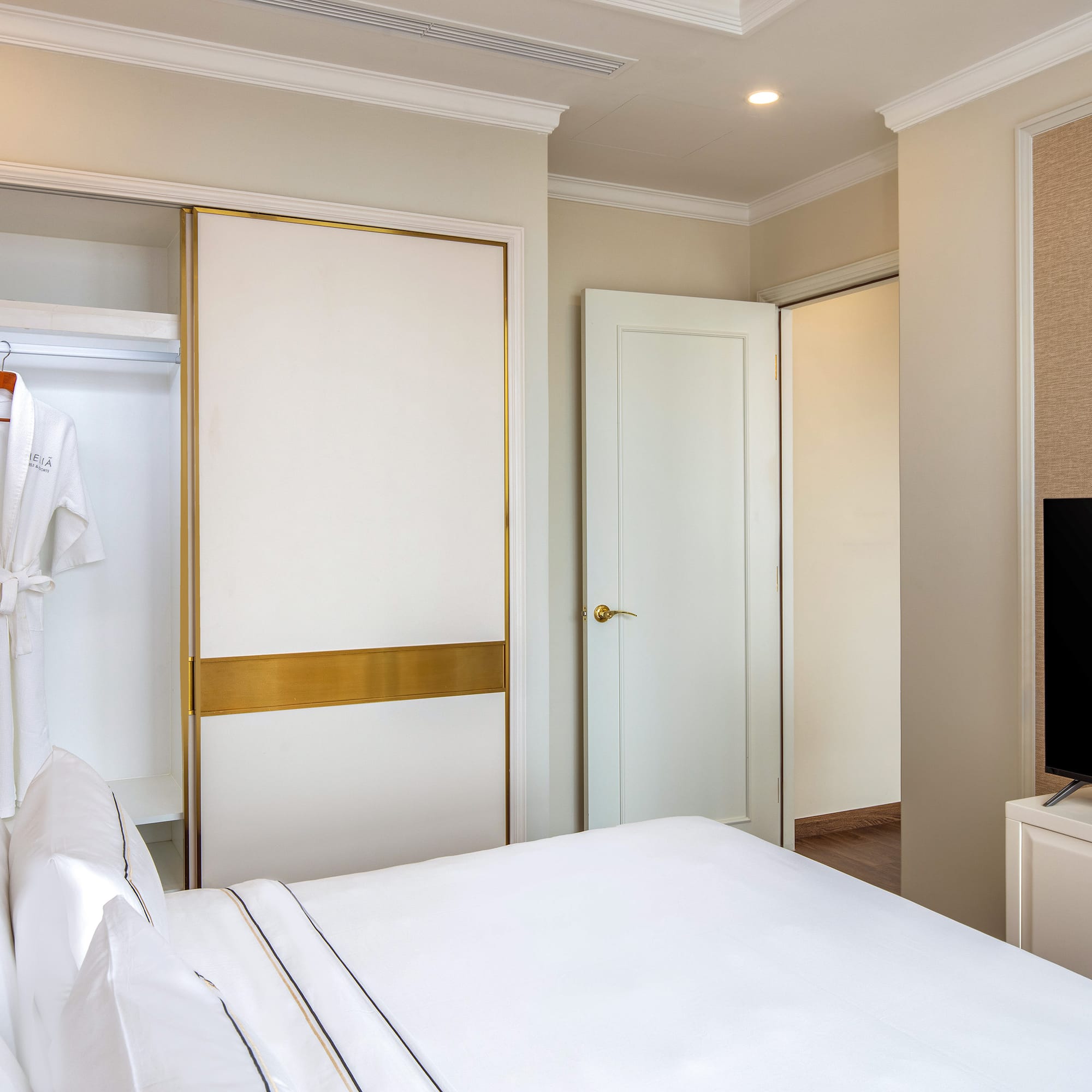 a room with a bed and a tv