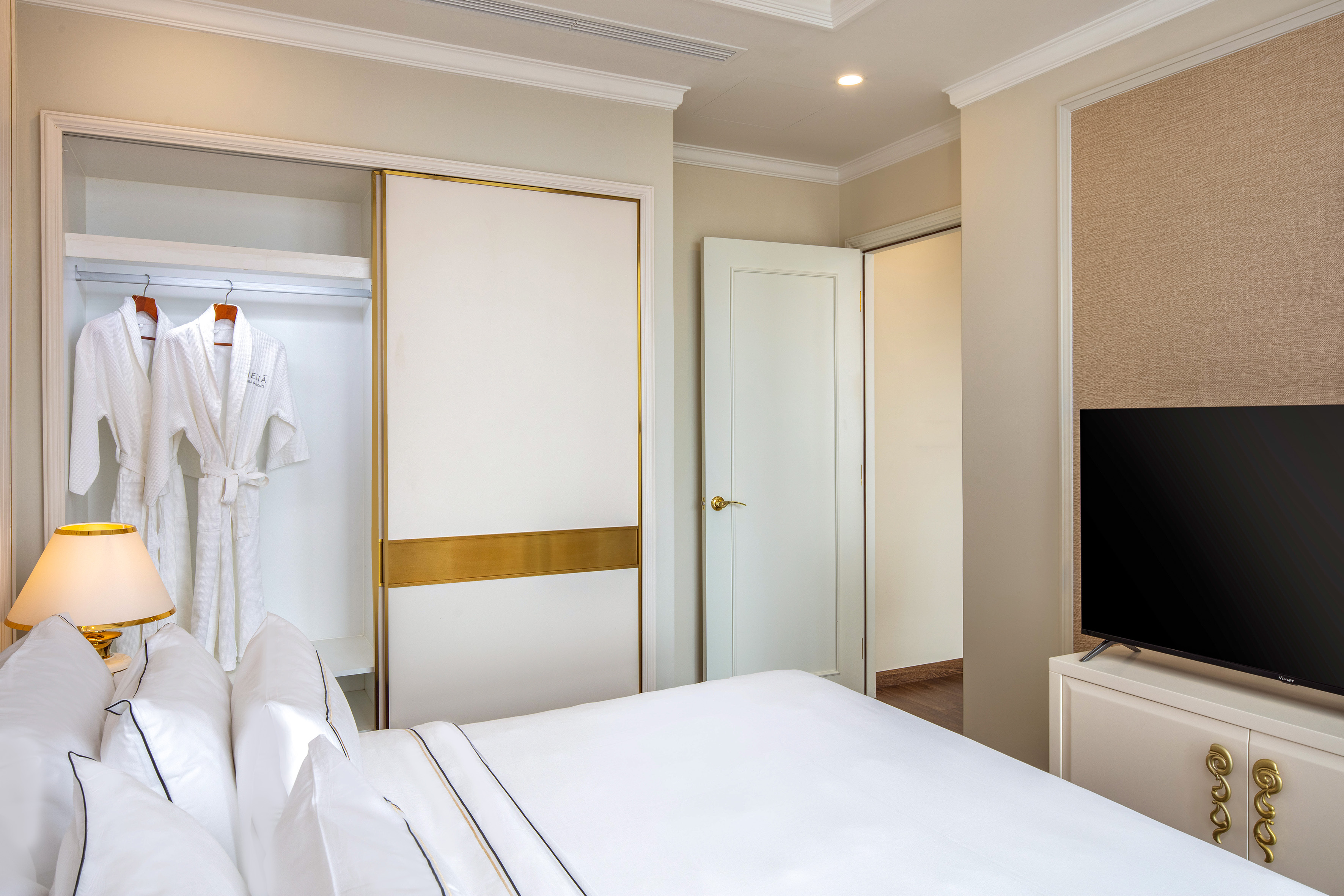 a room with a bed and a tv